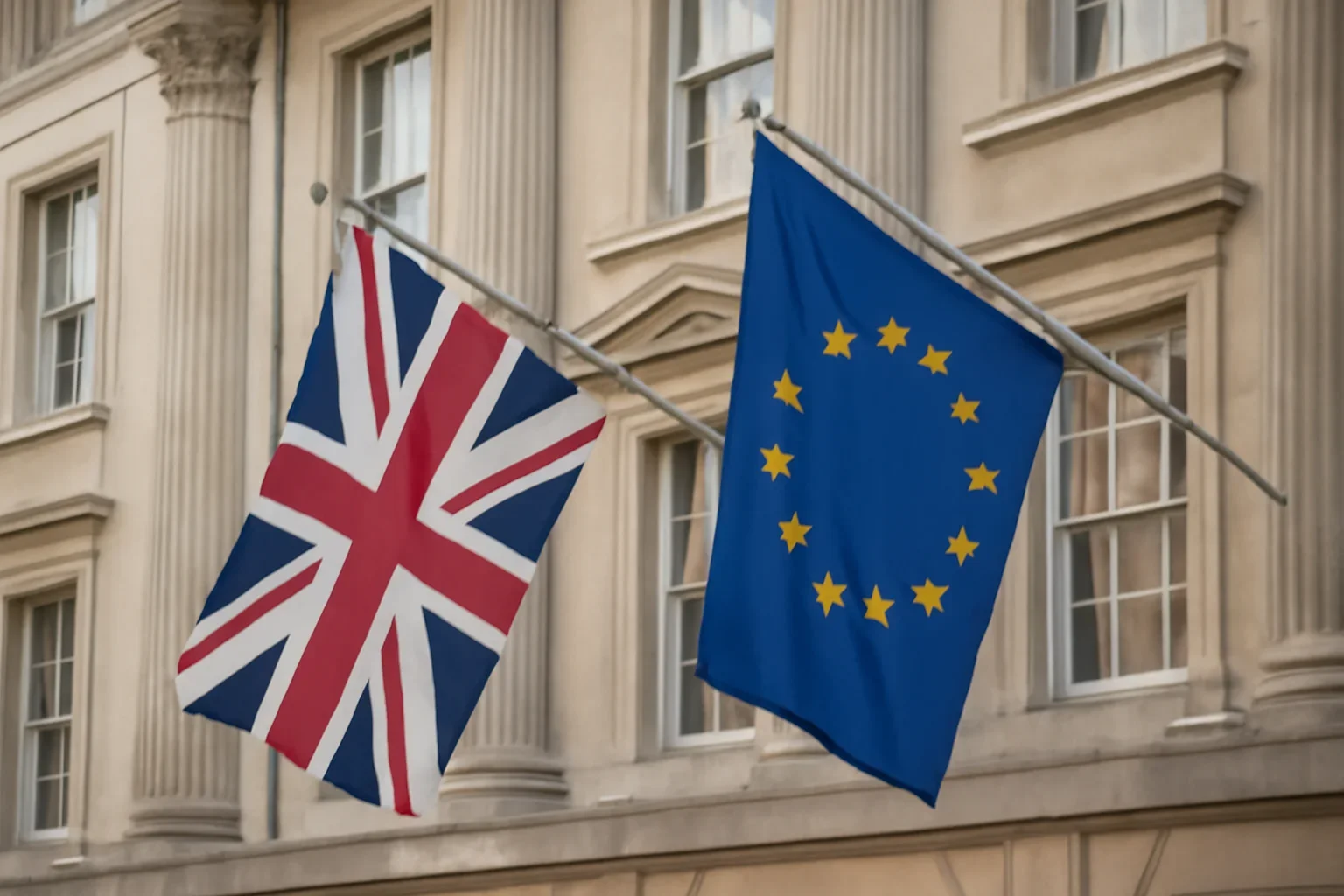 UK and EU flags outside a civic building in soft daylight