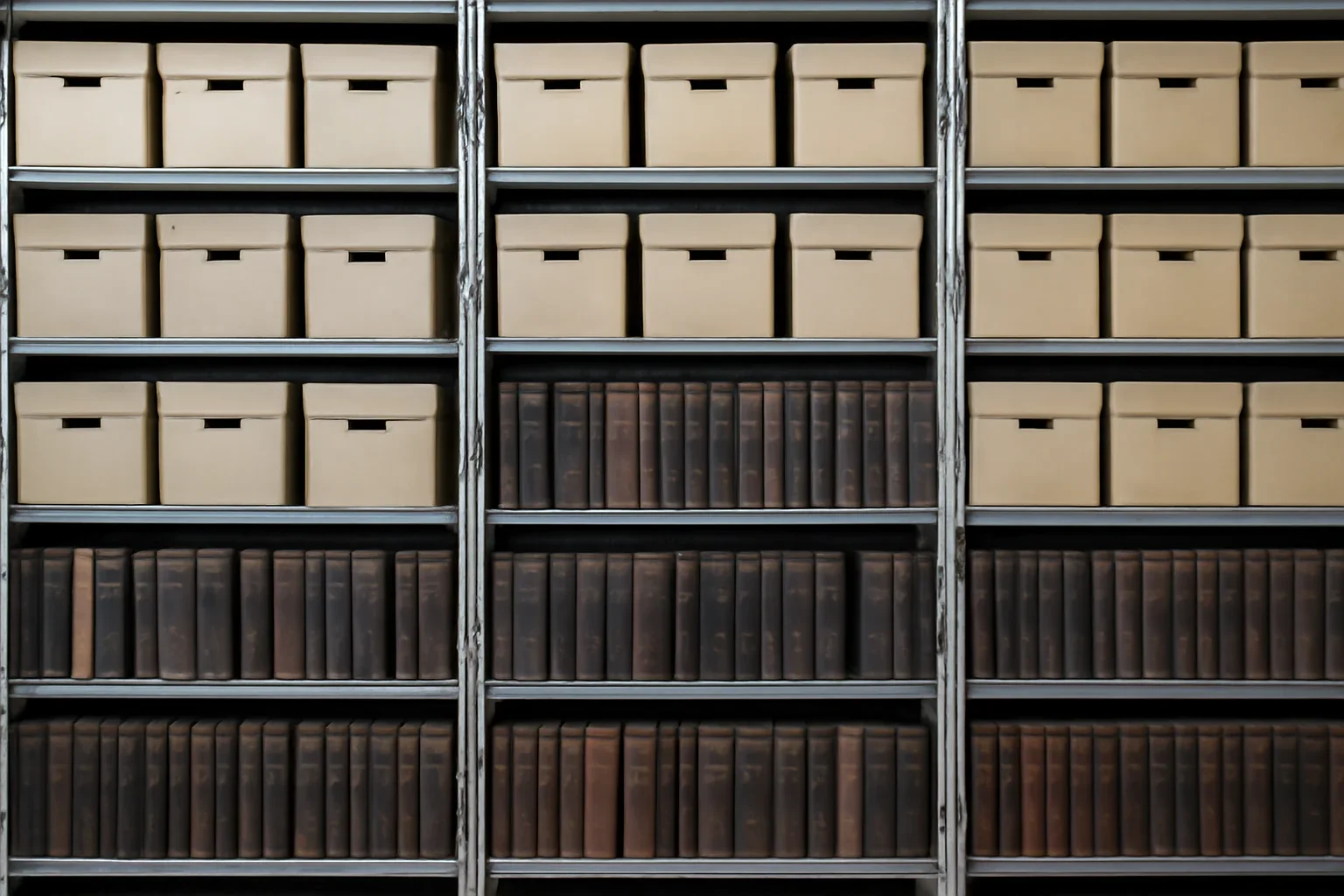 Archive shelves with labelled magazine boxes and bound volumes